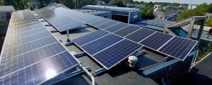 A commercial flat roof with solar panels installed