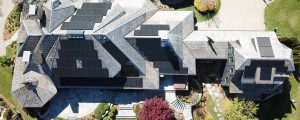 Multiple roof solar panels installed on a large house