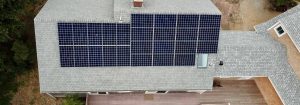 A residential solar panel installation on Cape Cod with panels on the south facing roof